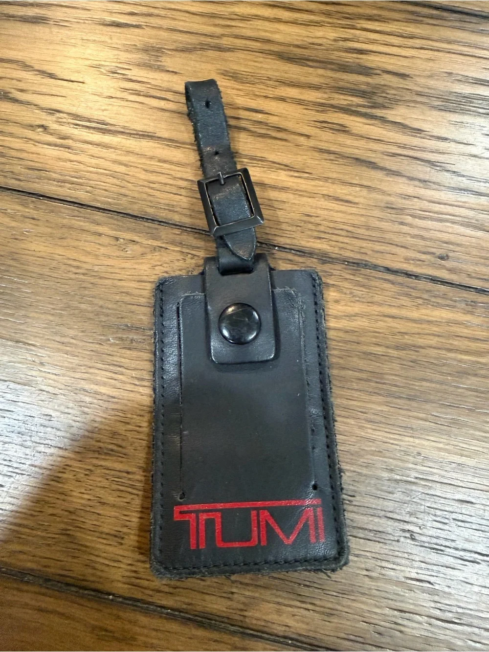 Tumi Black Leather Luggage Tag with Red Logo Accent